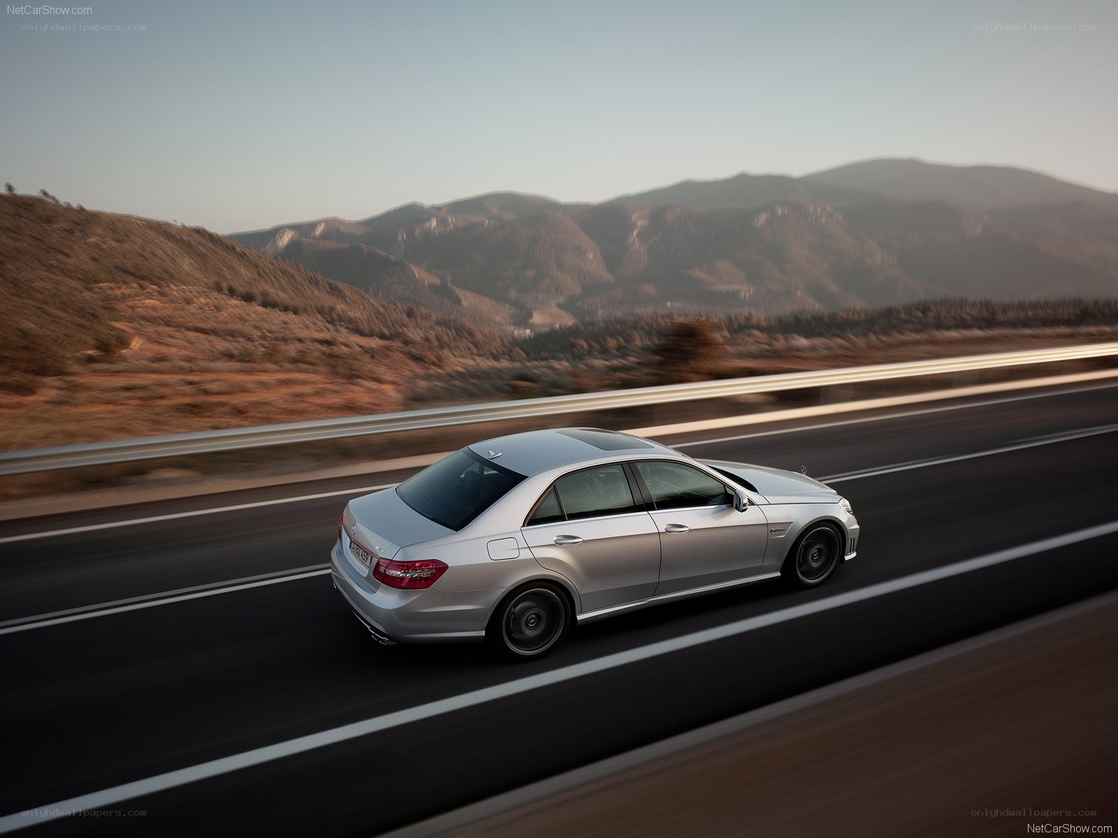 Silver sedan on mountain highway