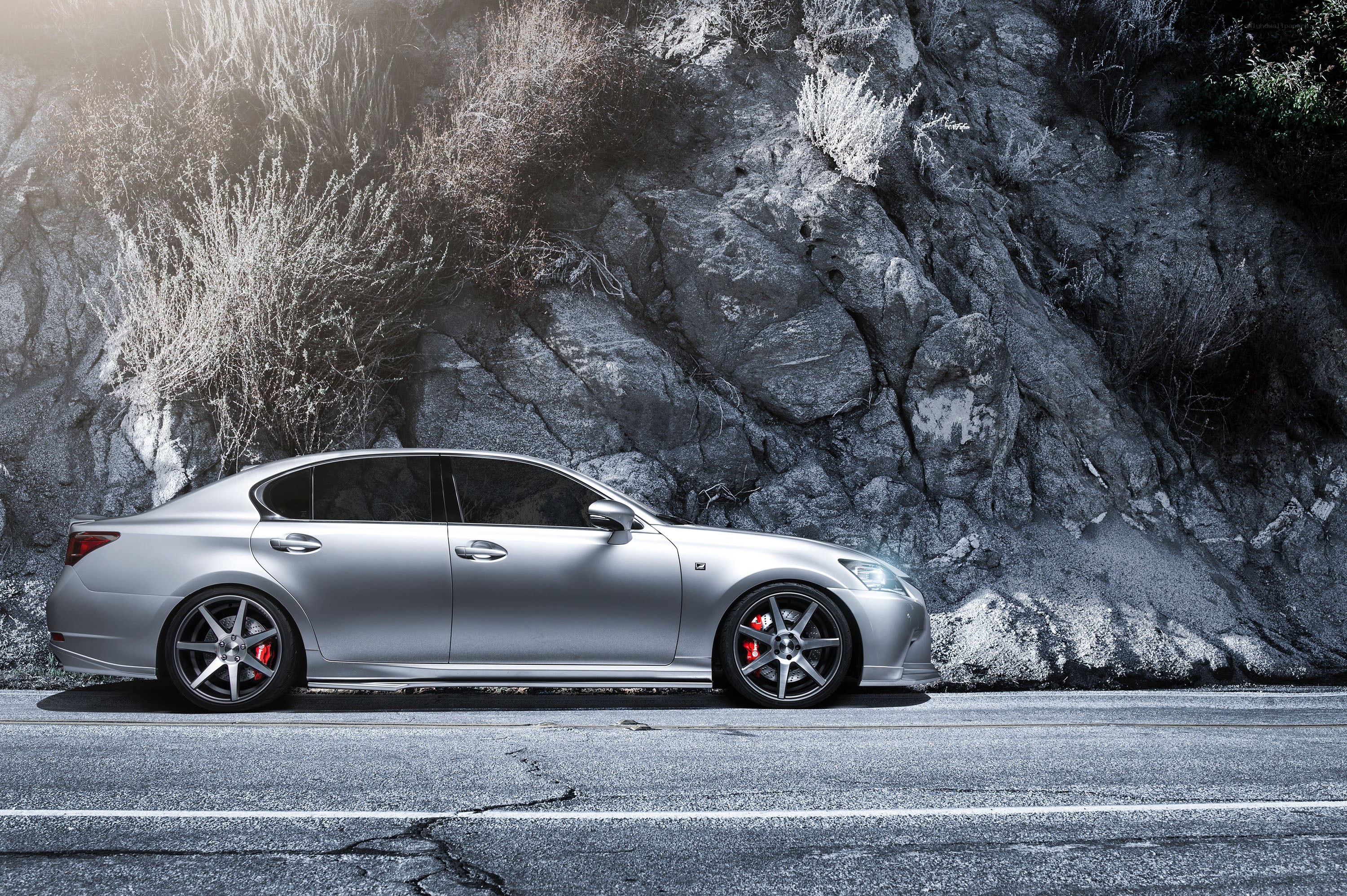 silver sedan on mountain road