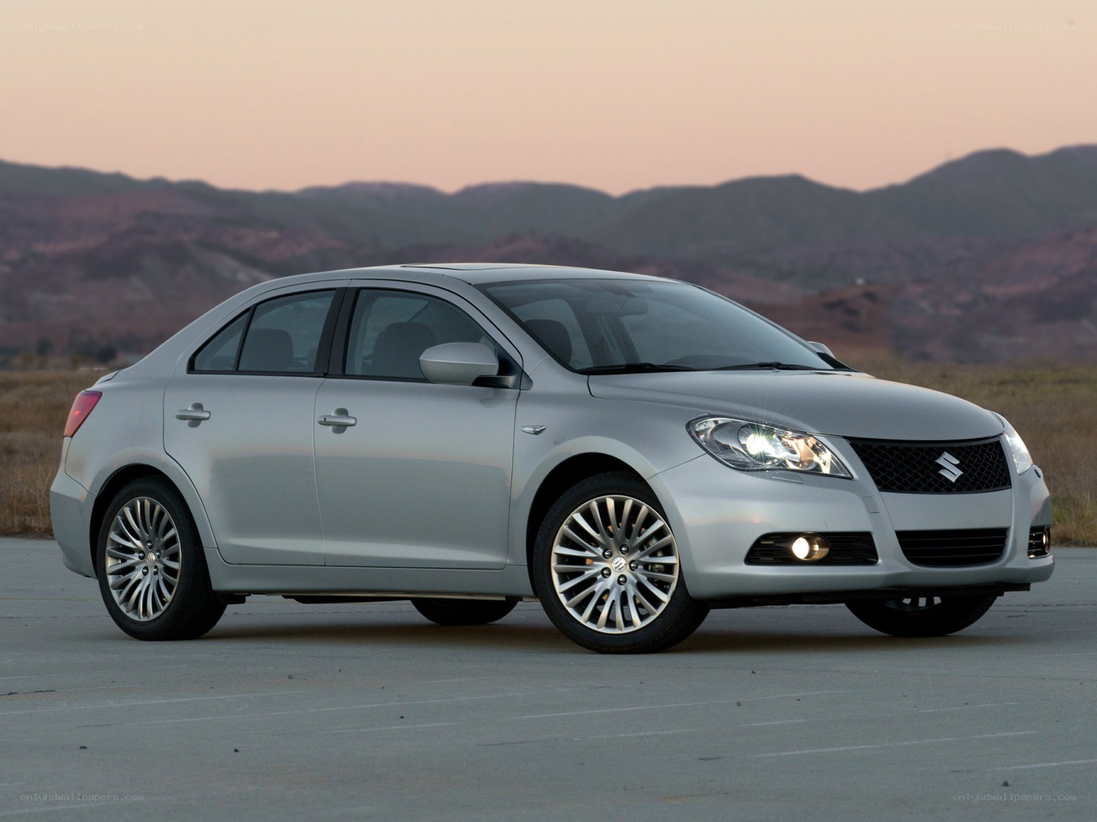 silver sedan on pavement