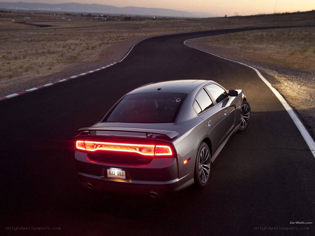silver sedan on racetrack