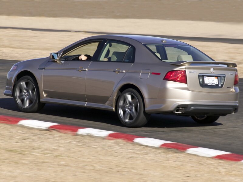 silver sedan on racetrack