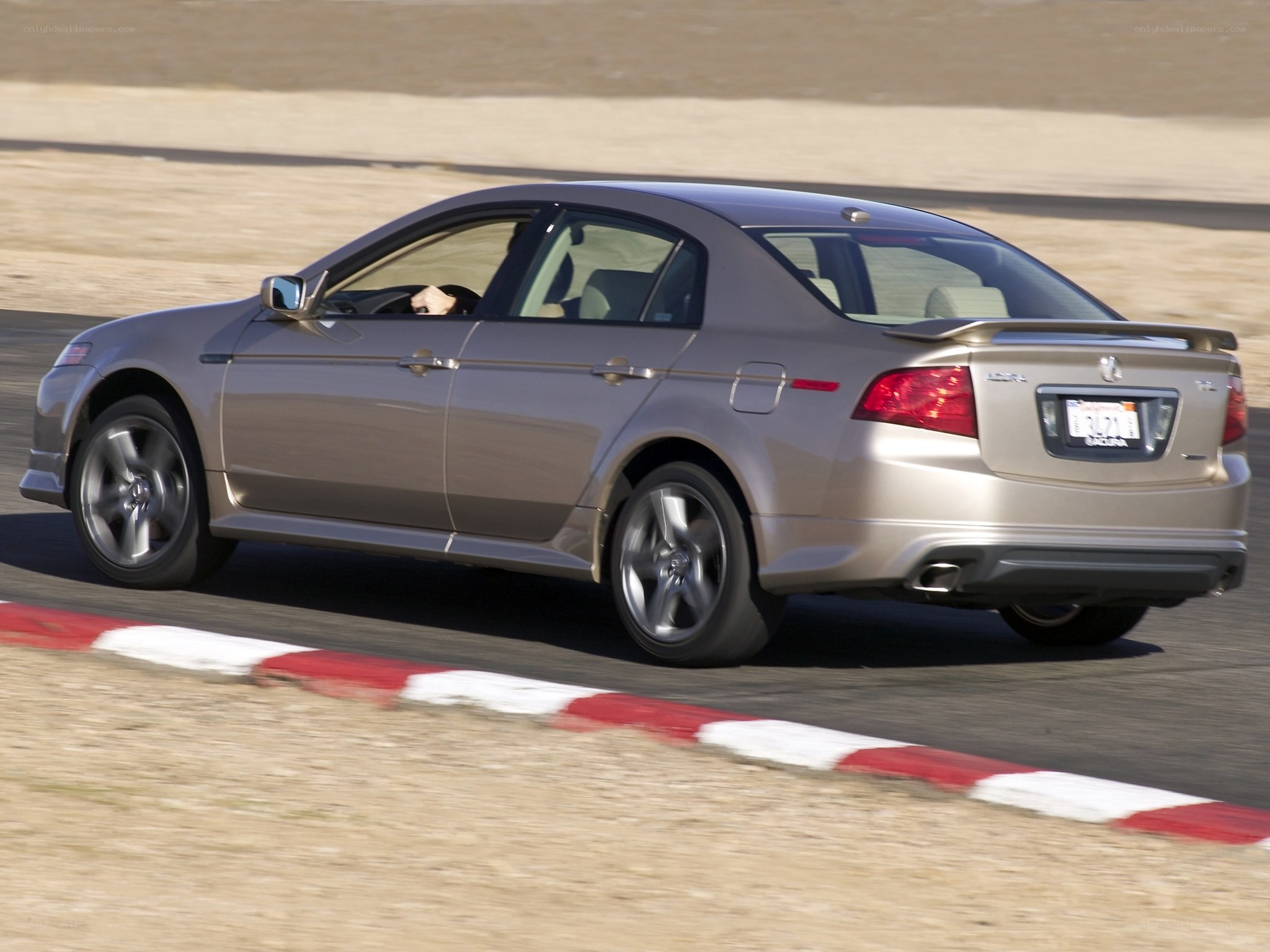 silver sedan on racetrack
