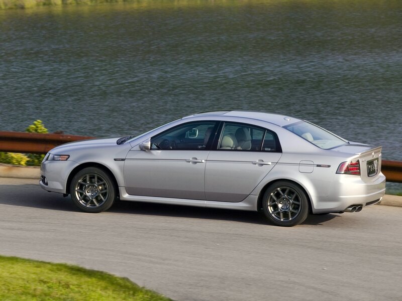 silver sedan on road