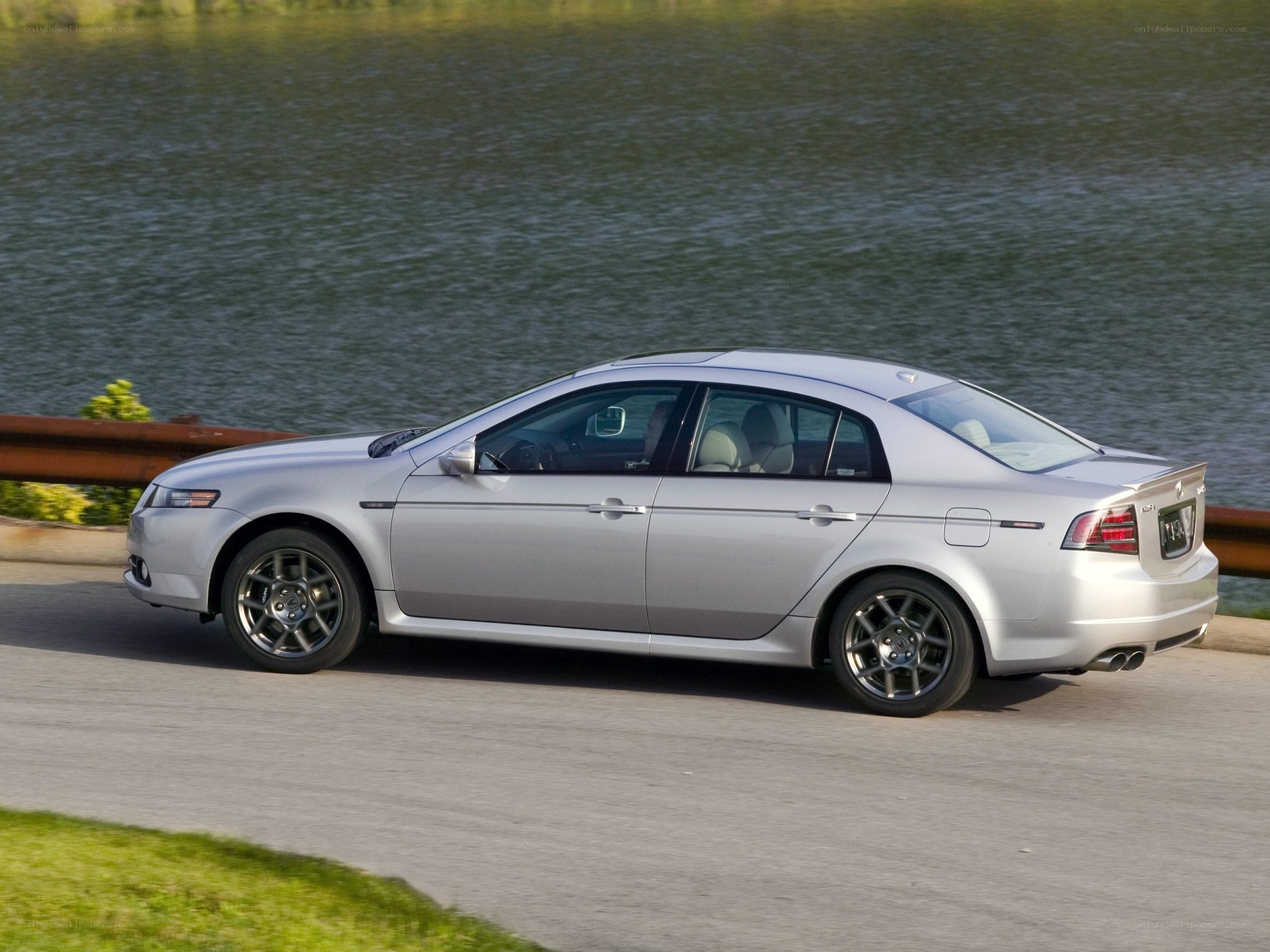 silver sedan on road