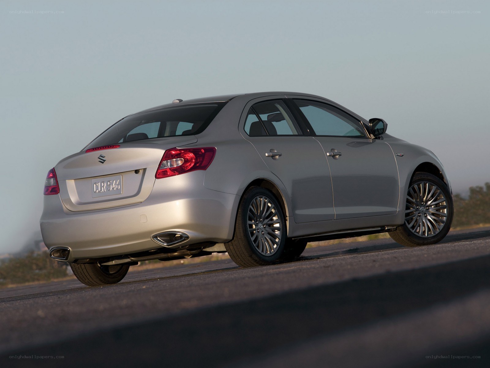 silver sedan on road