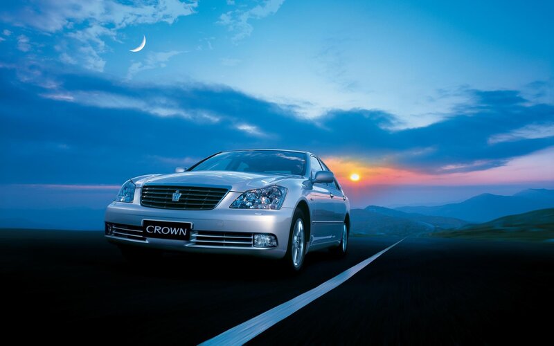 Silver Sedan on Road — Blue