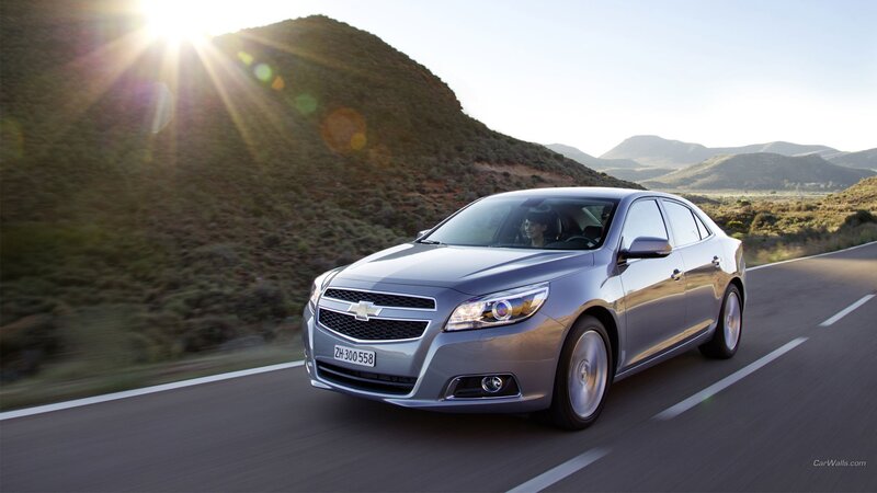 Silver Sedan on Road — Dramatic