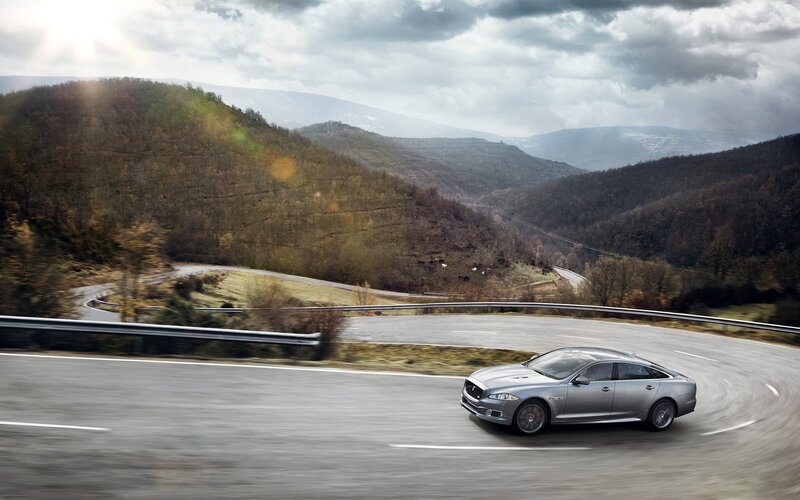Silver Sedan on Road — Gray, Dramatic