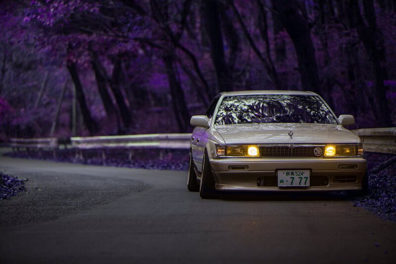 Silver Sedan on Road — Purple