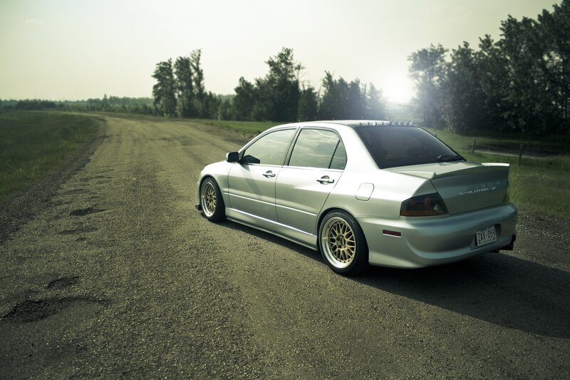 Silver Sedan on Road — Serene, Afternoon