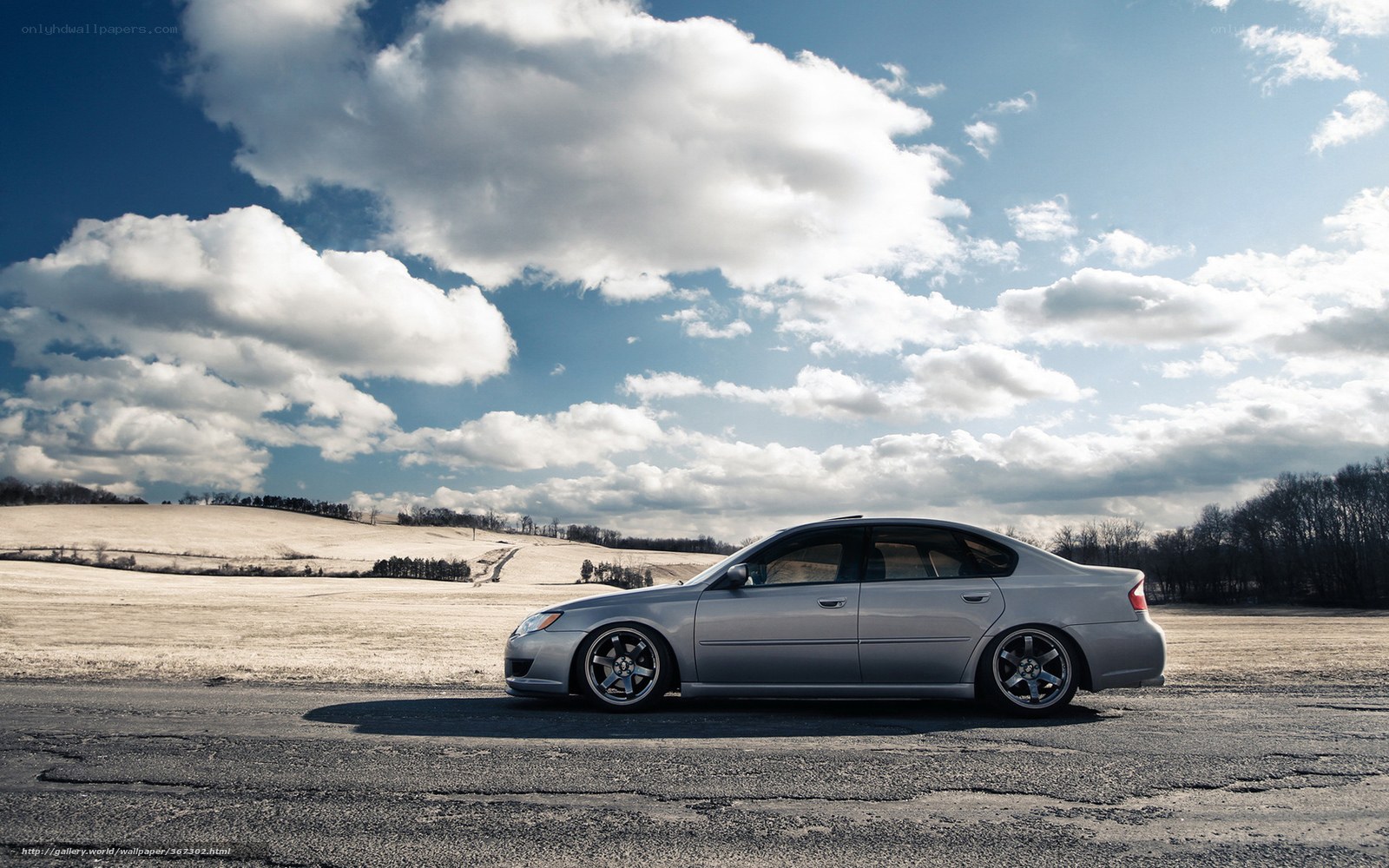 silver sedan on rural road