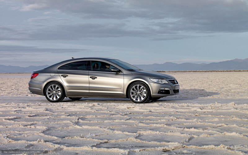 silver sedan on salt flat
