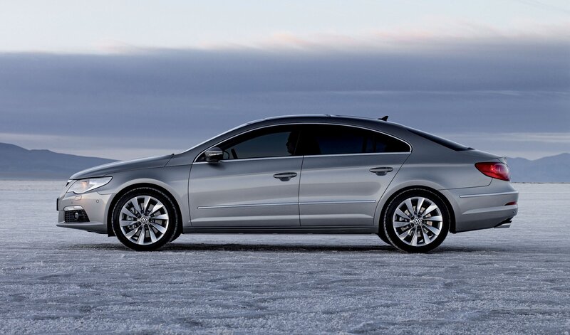 silver sedan on salt flat