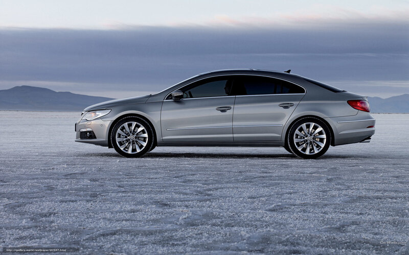silver sedan on salt flat