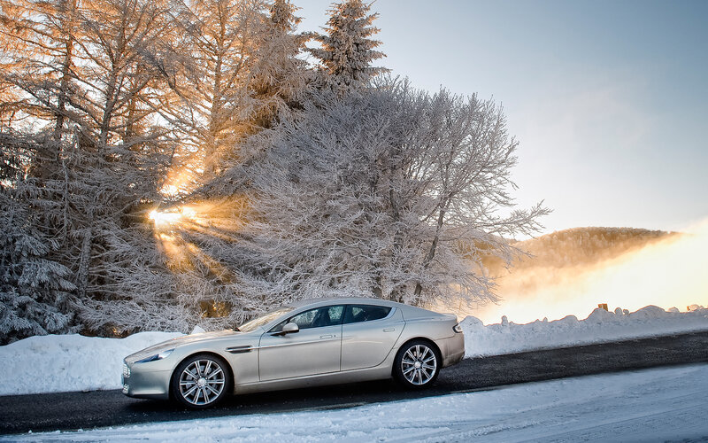 Silver Sedan on Snowy Road