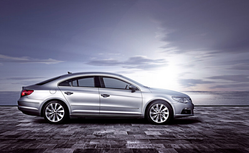silver sedan on stone pier