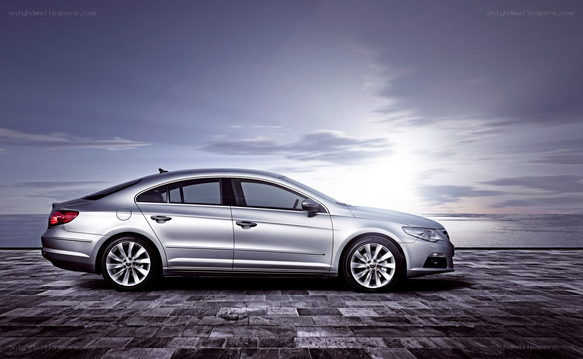 silver sedan on stone pier