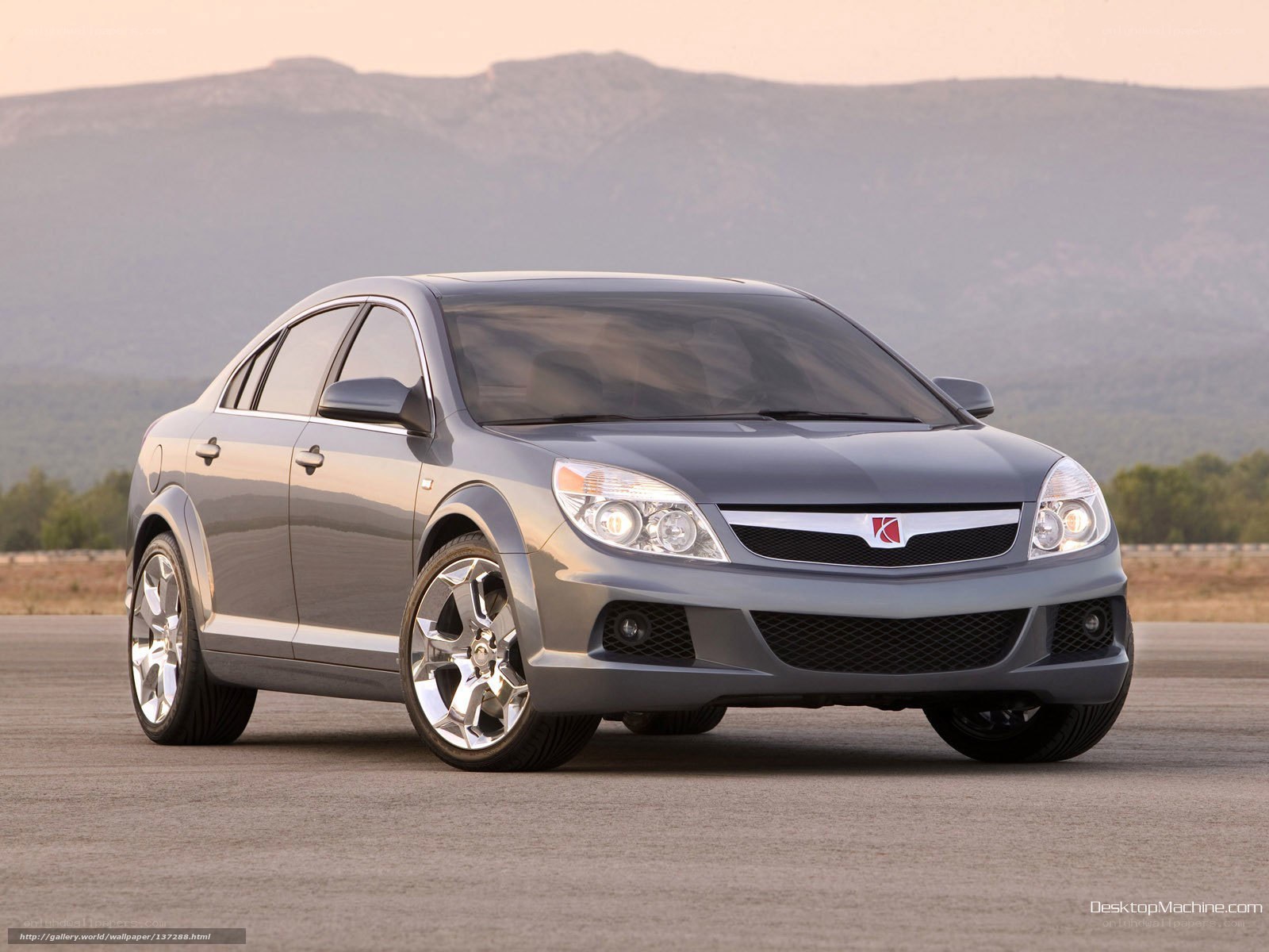 silver sedan on tarmac