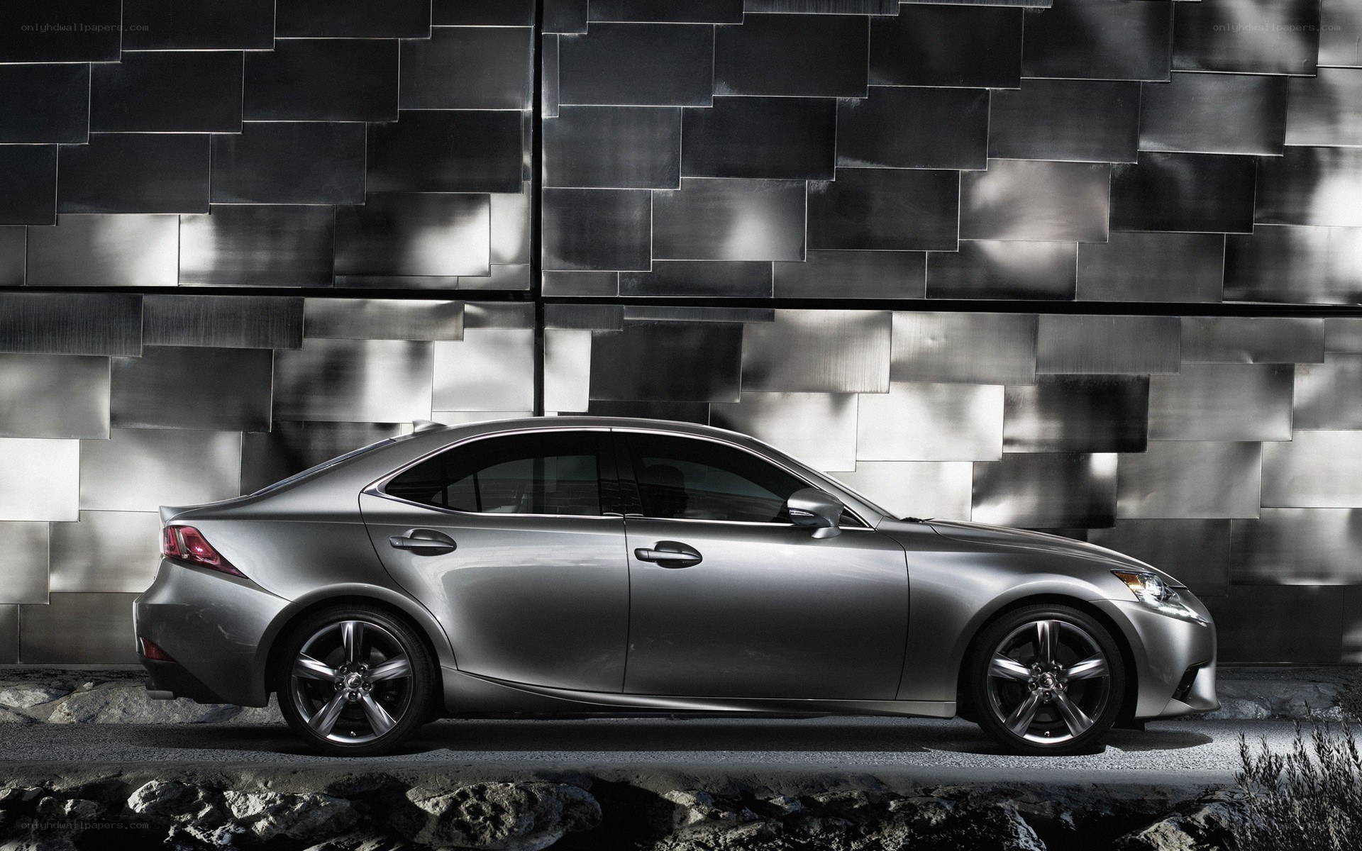 silver sedan on textured wall