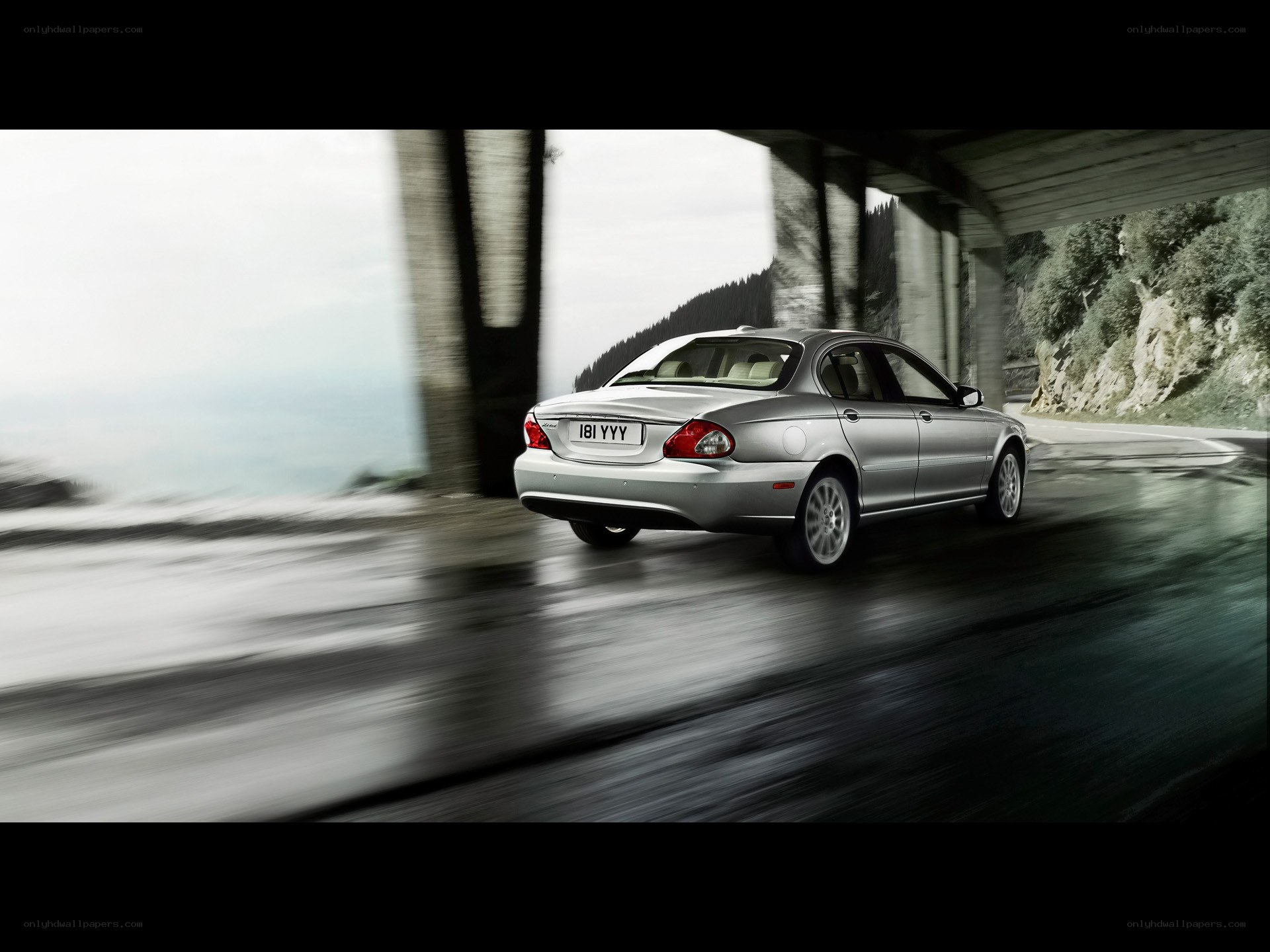 Silver sedan on winding road