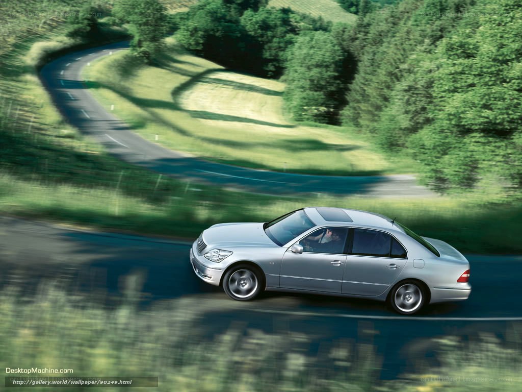 silver sedan on winding road