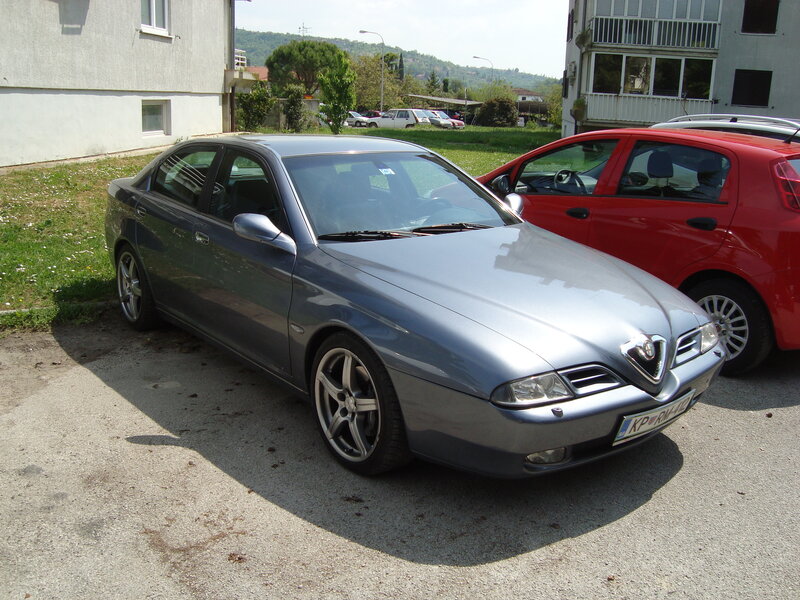 Silver sedan parked in lot