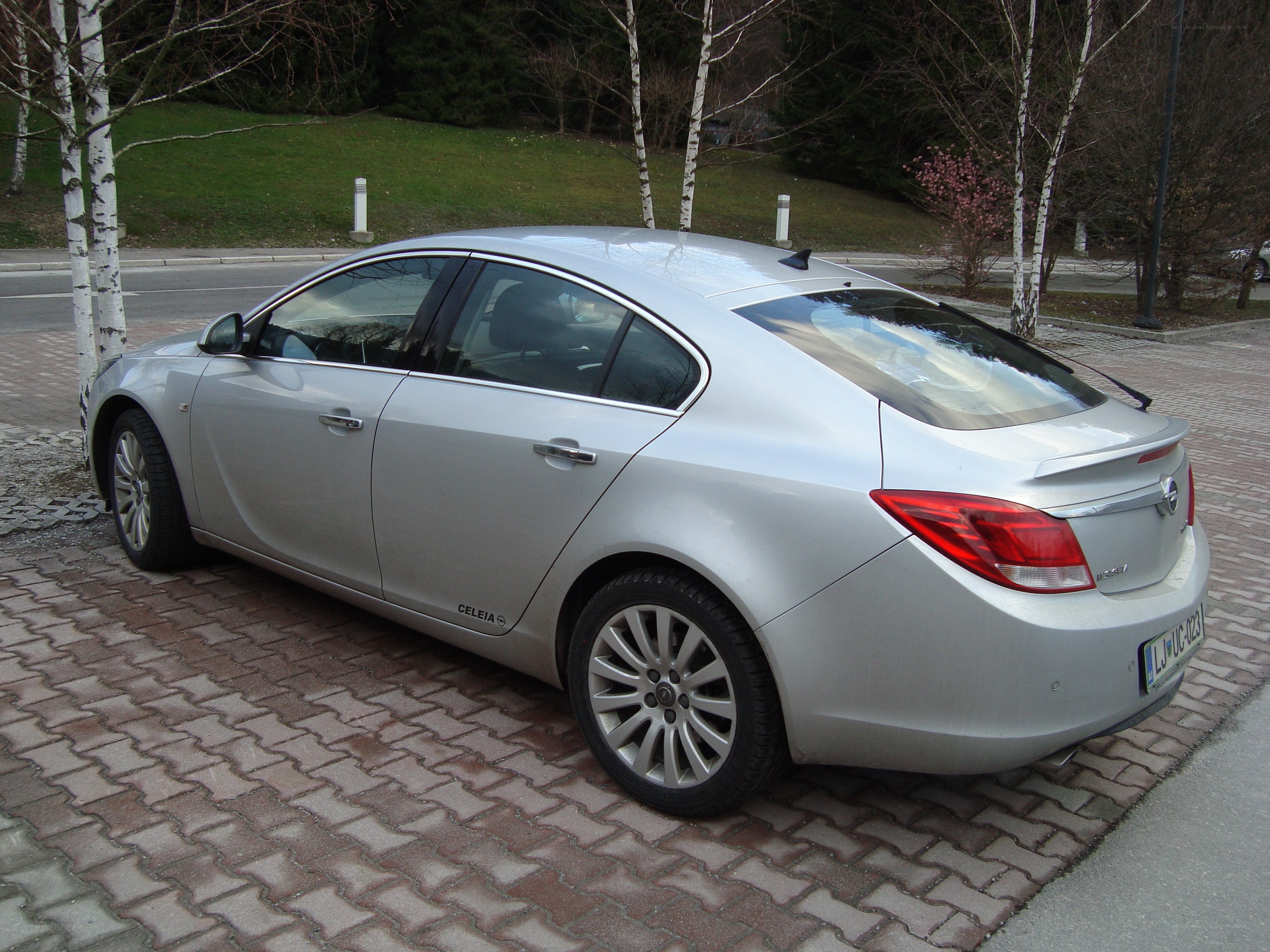 silver sedan parked on pavement