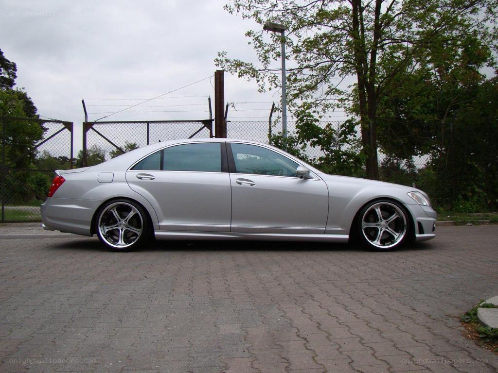 silver sedan parked on pavement