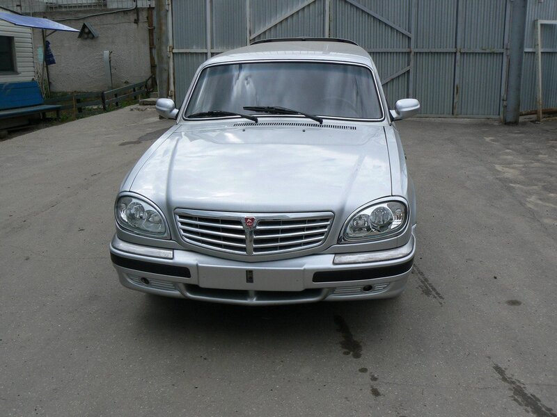 silver sedan parked outside