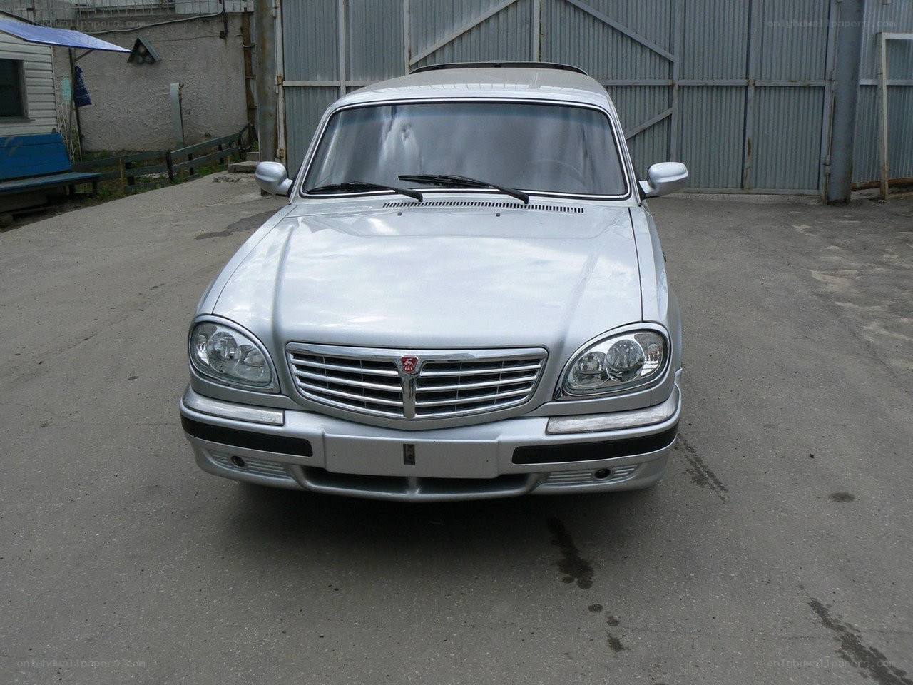 silver sedan parked outside