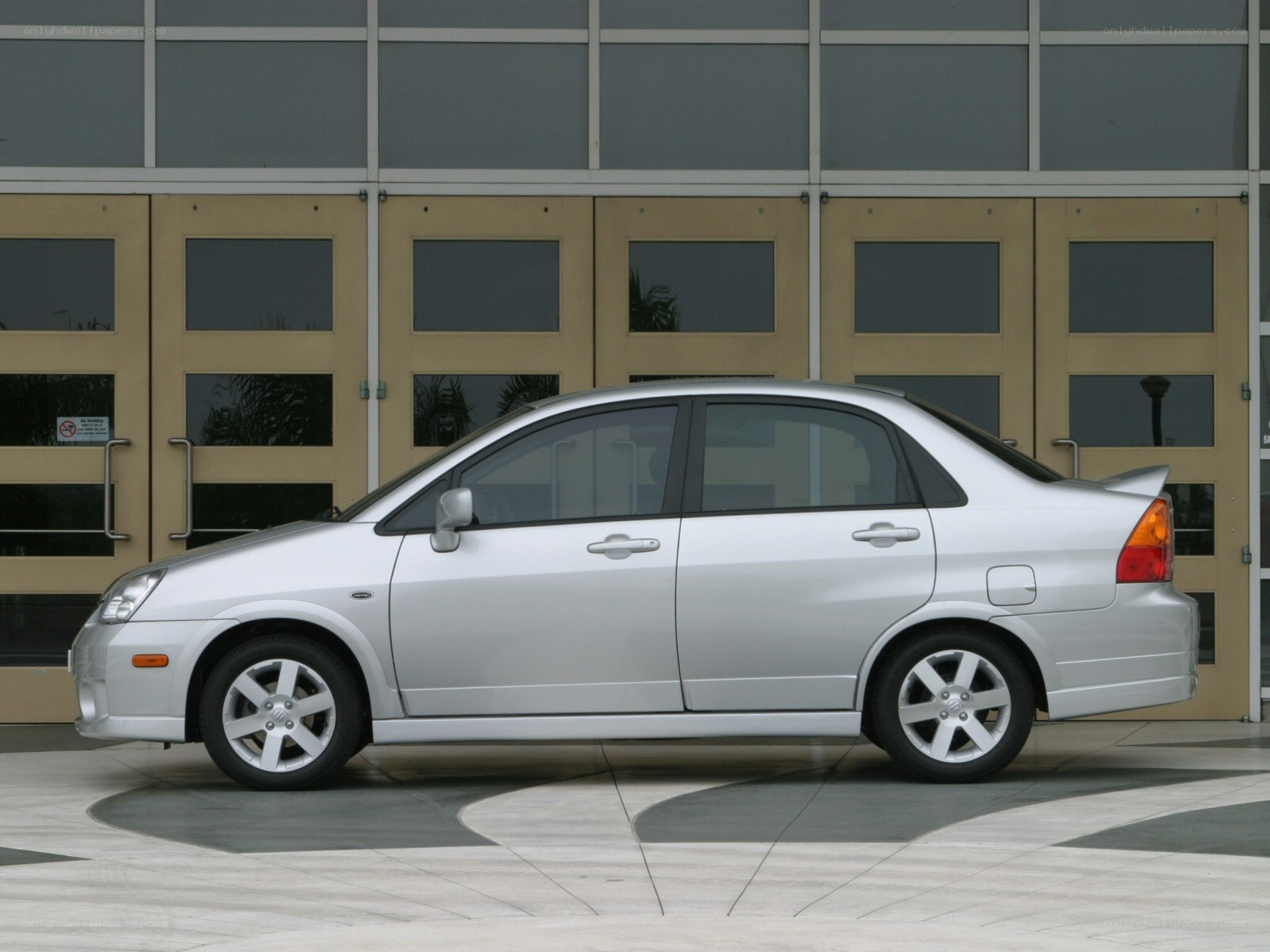 silver sedan parked outside