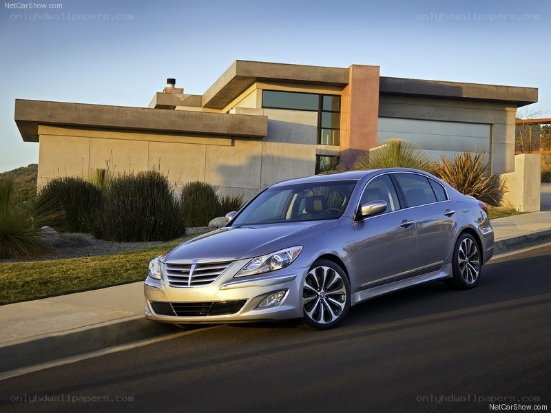 silver sedan parked outside modern home