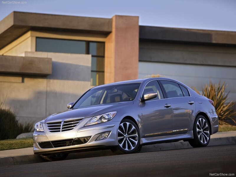 silver sedan parked outside modern home
