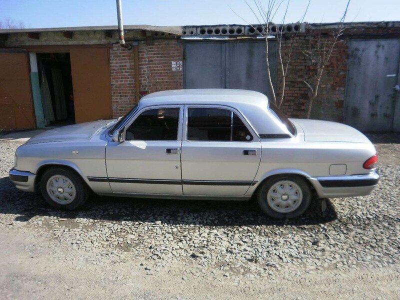 silver sedan parked outside