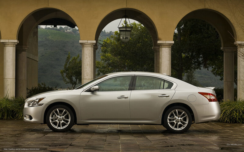 Silver sedan under arches