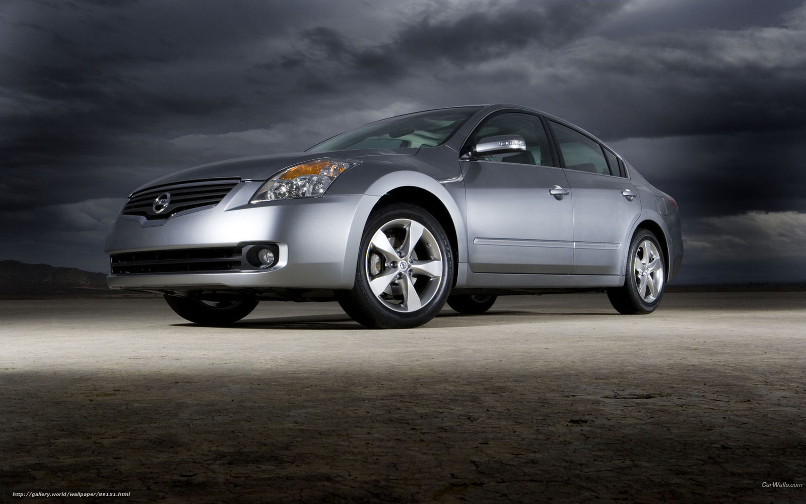 silver sedan under stormy sky