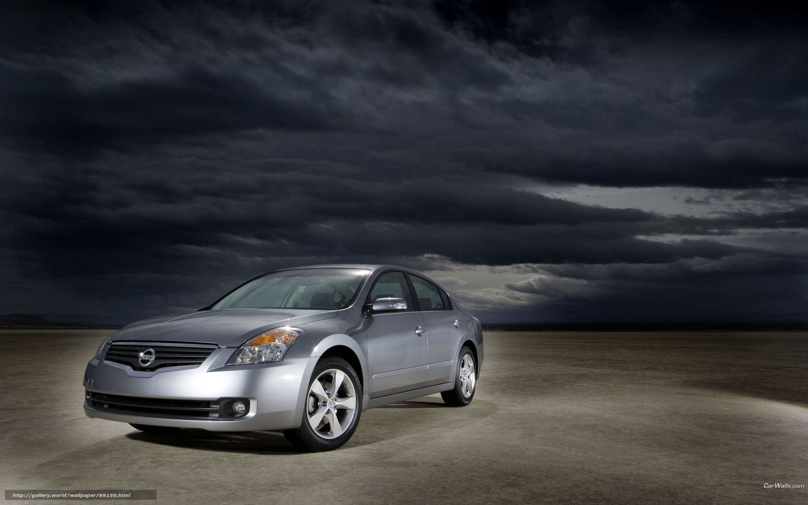 Silver sedan under stormy sky