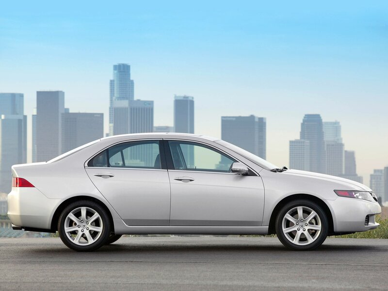 silver sedan with city skyline