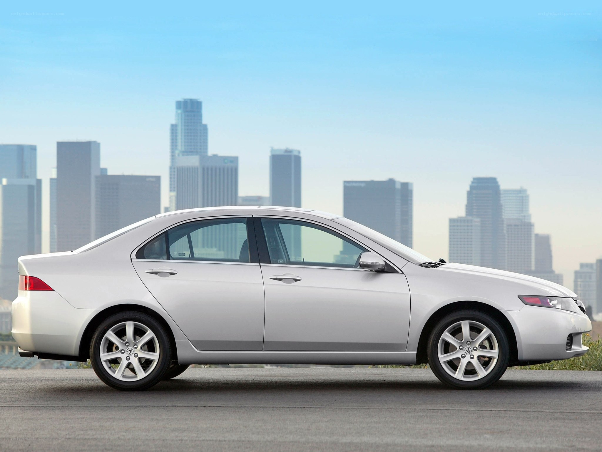 silver sedan with city skyline