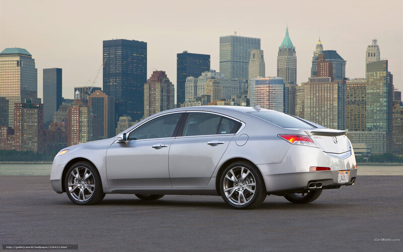 Silver sedan with city skyline