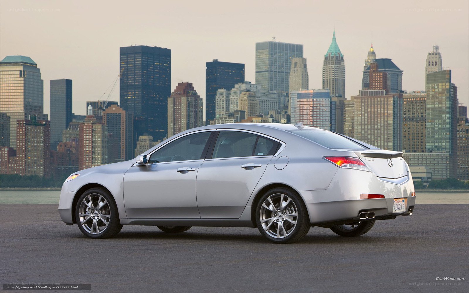 Silver sedan with city skyline