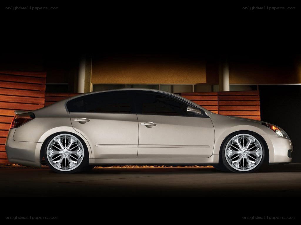 silver sedan with custom wheels