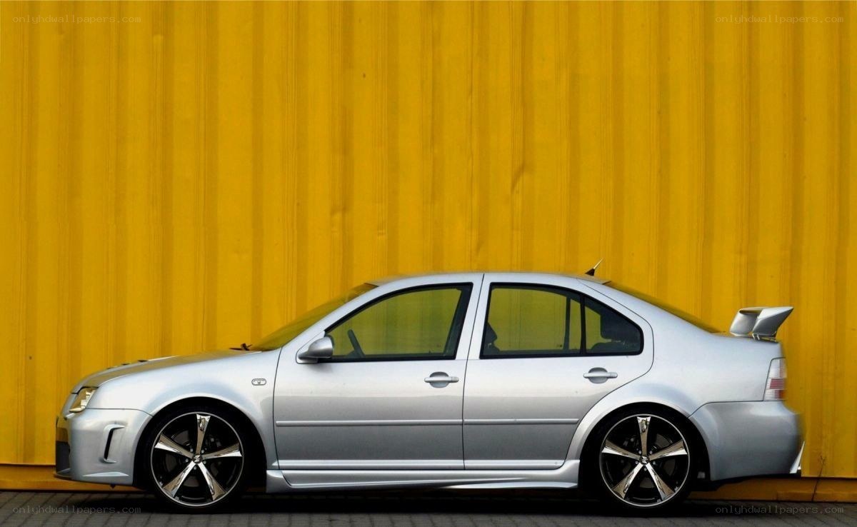 silver sedan with custom wheels