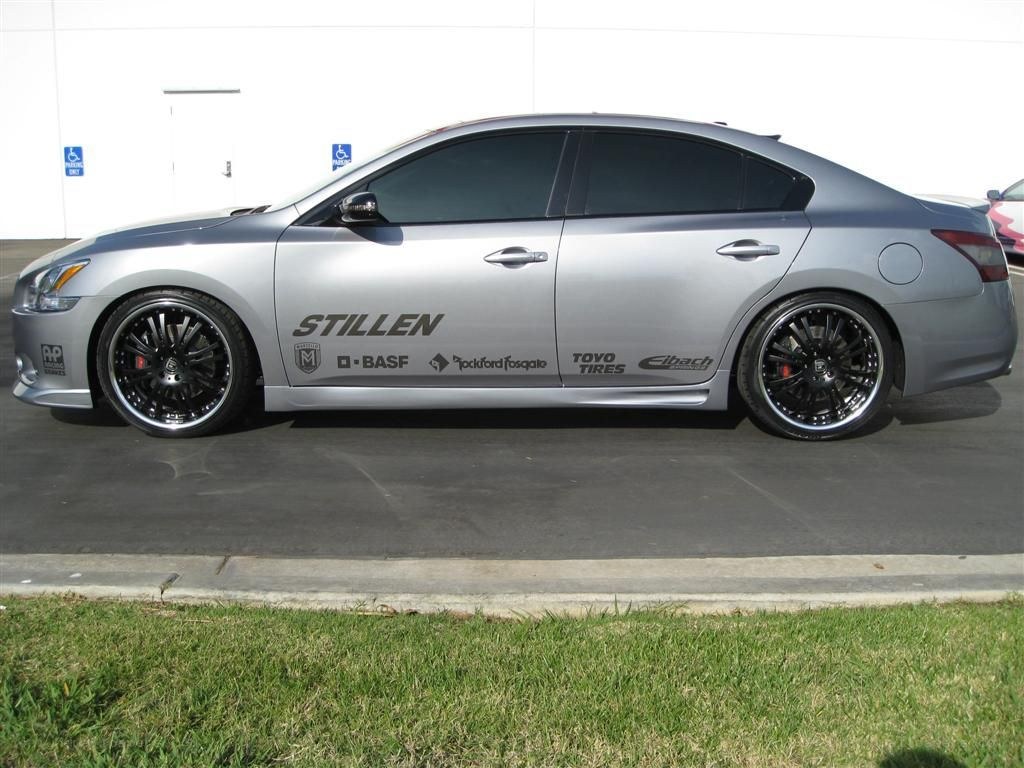 silver sedan with custom wheels