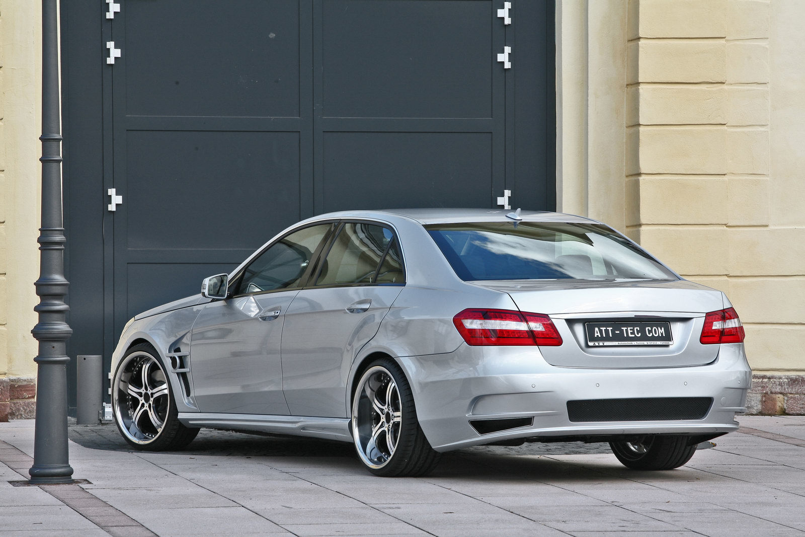 silver sedan with custom wheels