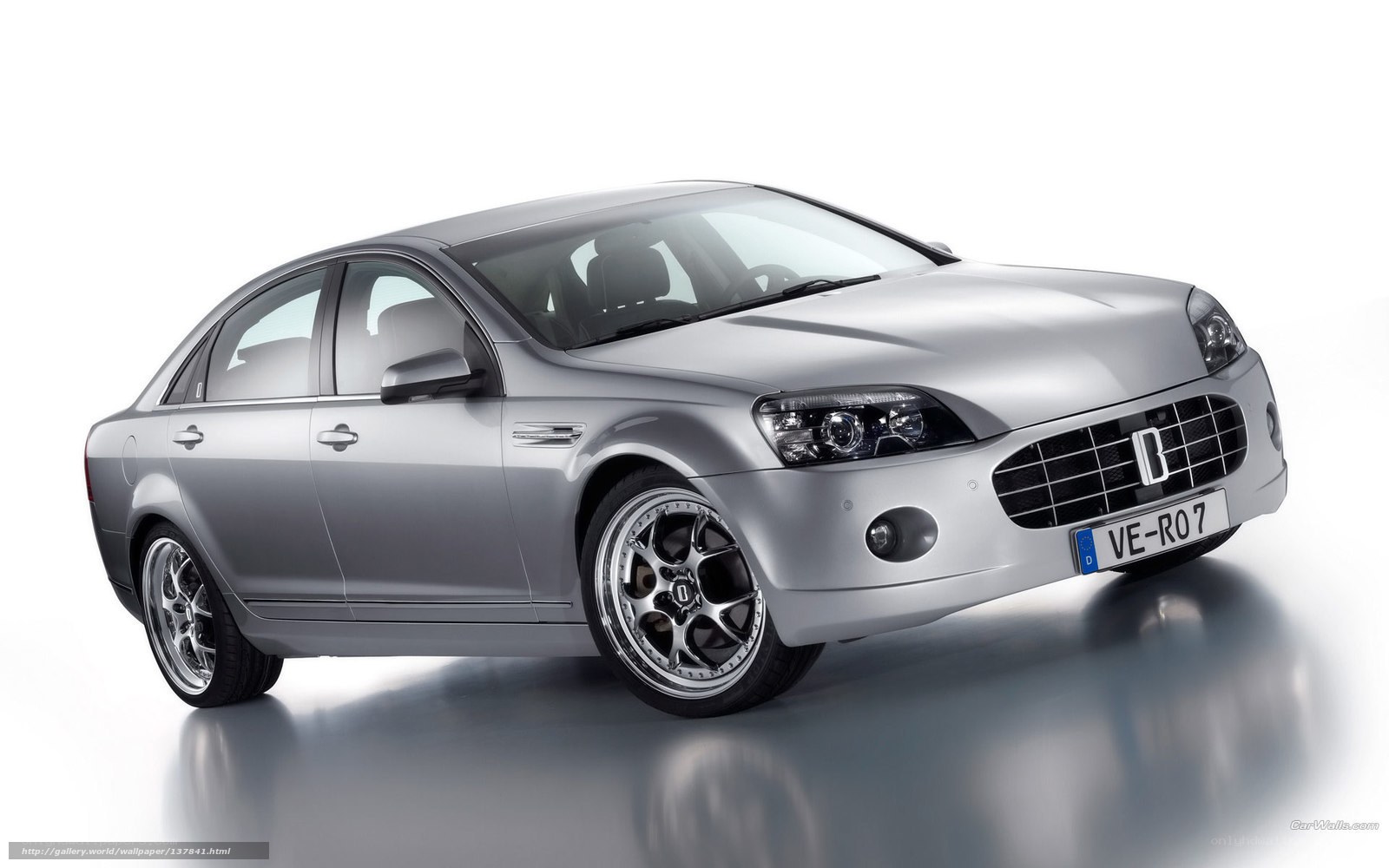 silver sedan with custom wheels