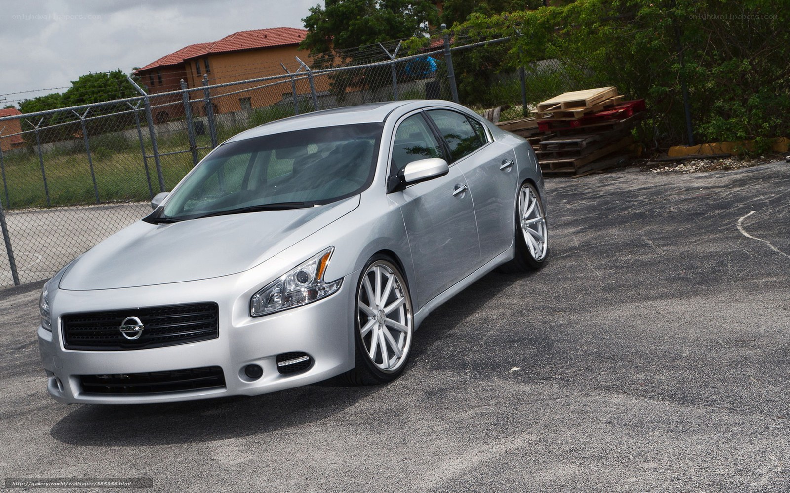 silver sedan with custom wheels