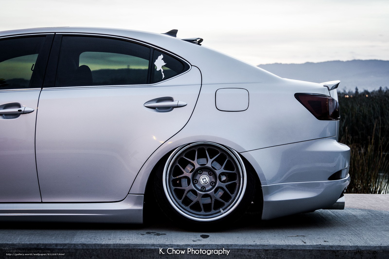 silver sedan with custom wheels