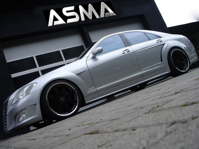 silver sedan with custom wheels