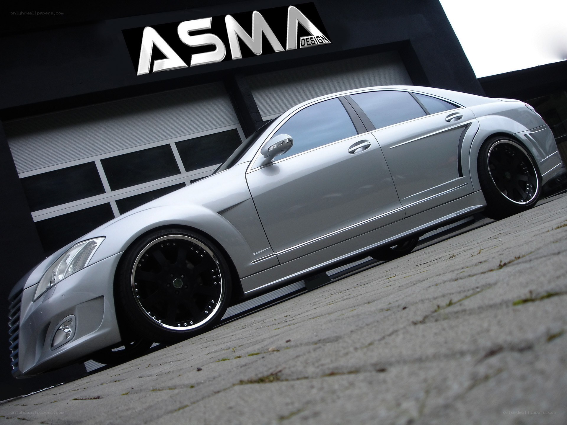 silver sedan with custom wheels